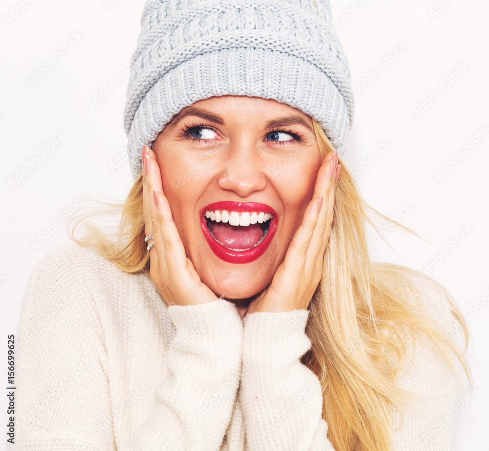 Happy young woman in winter clothes