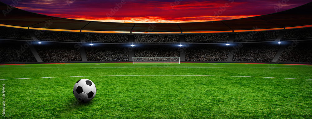 Soccer ball on green stadium