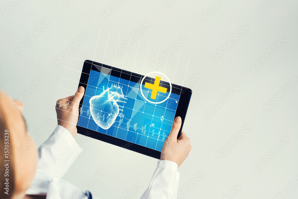 Close of female doctor hands working with tablet pc computer