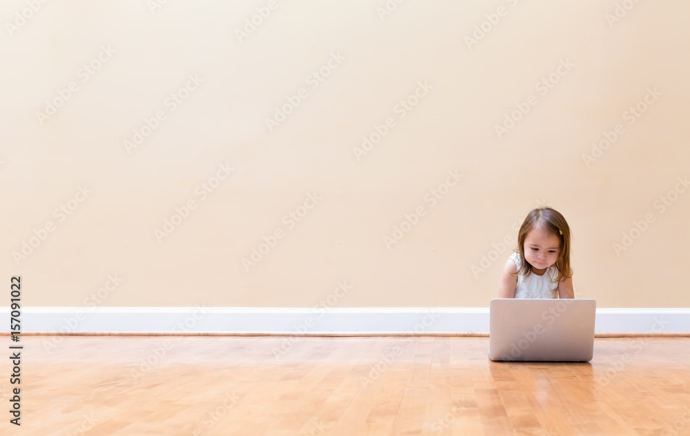 Little girl with her laptop computer