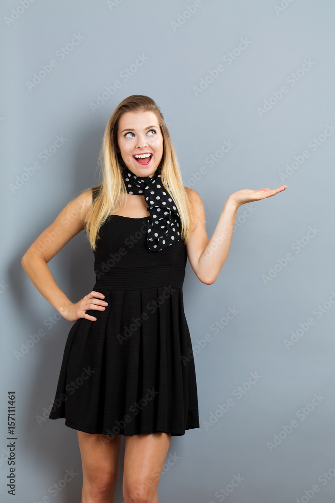 Young woman with a displaying hand gesture