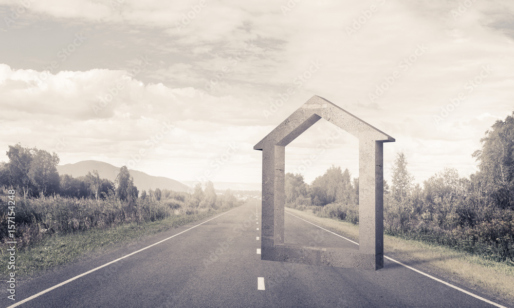 Conceptual background image of concrete home sign on asphalt roa