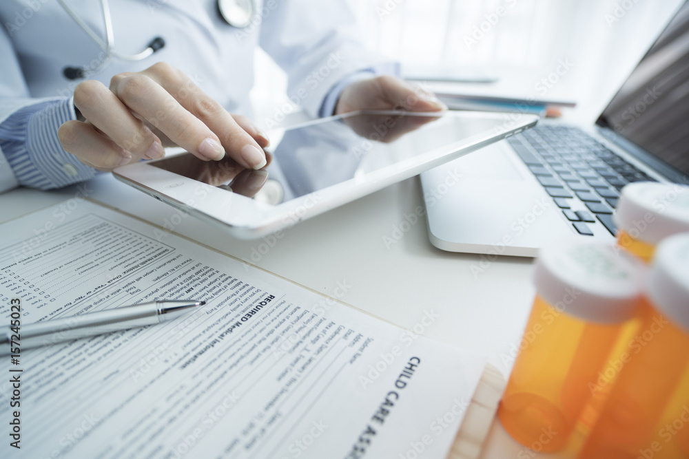 Female doctor pinch out tablet