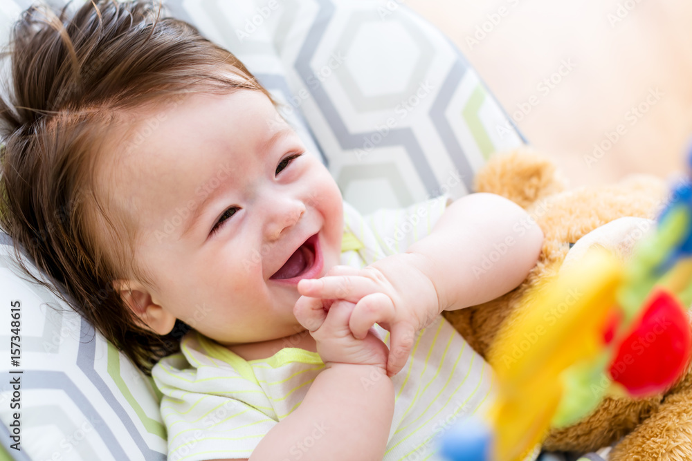 Baby boy playing with his toy