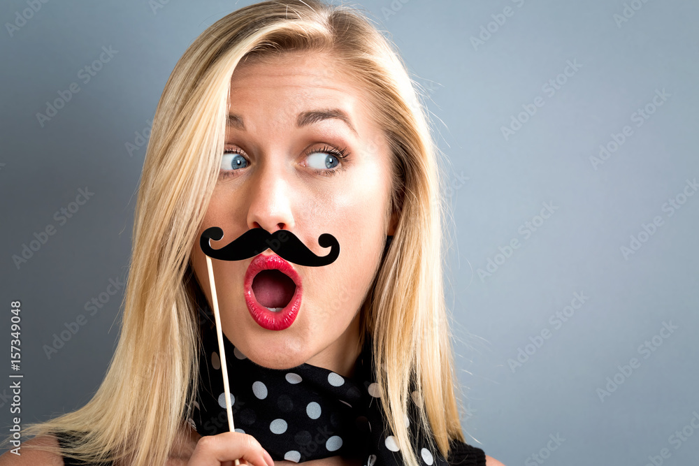 Young woman holding paper party sticks