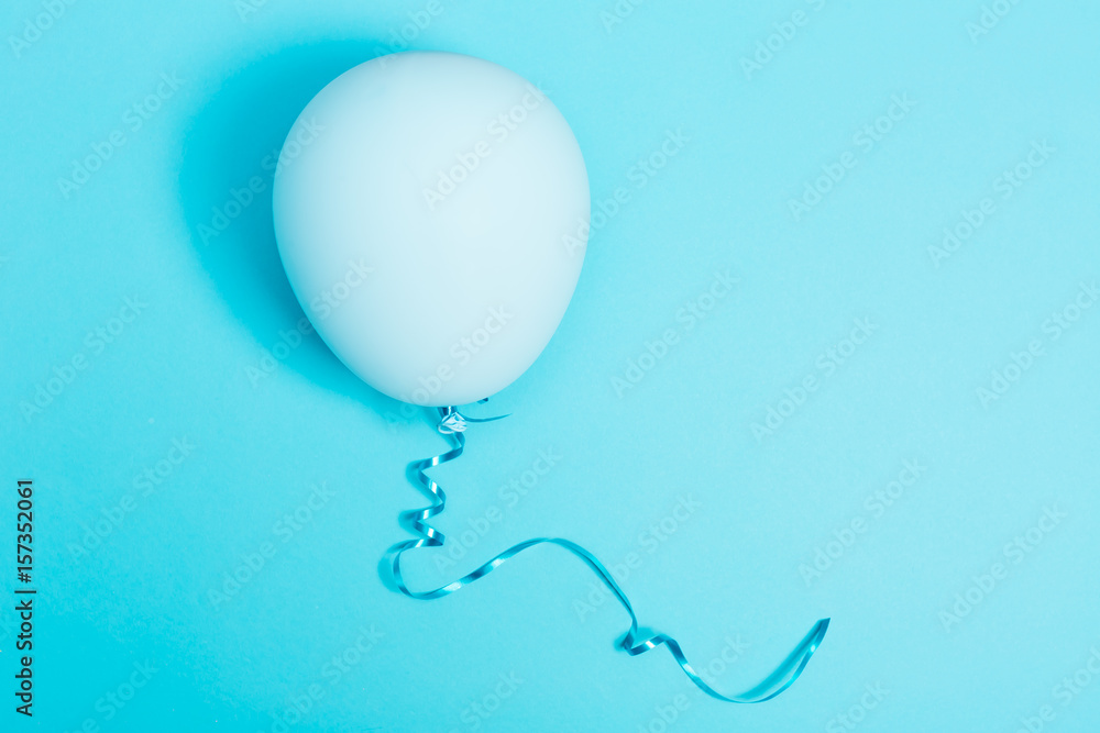 Blue balloon on a blue background