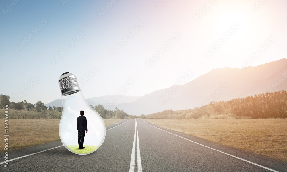 Businessman inside light bulb