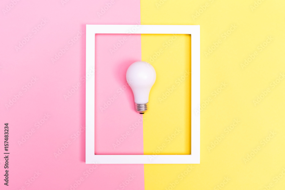 Colored lightbulb on a duotone background