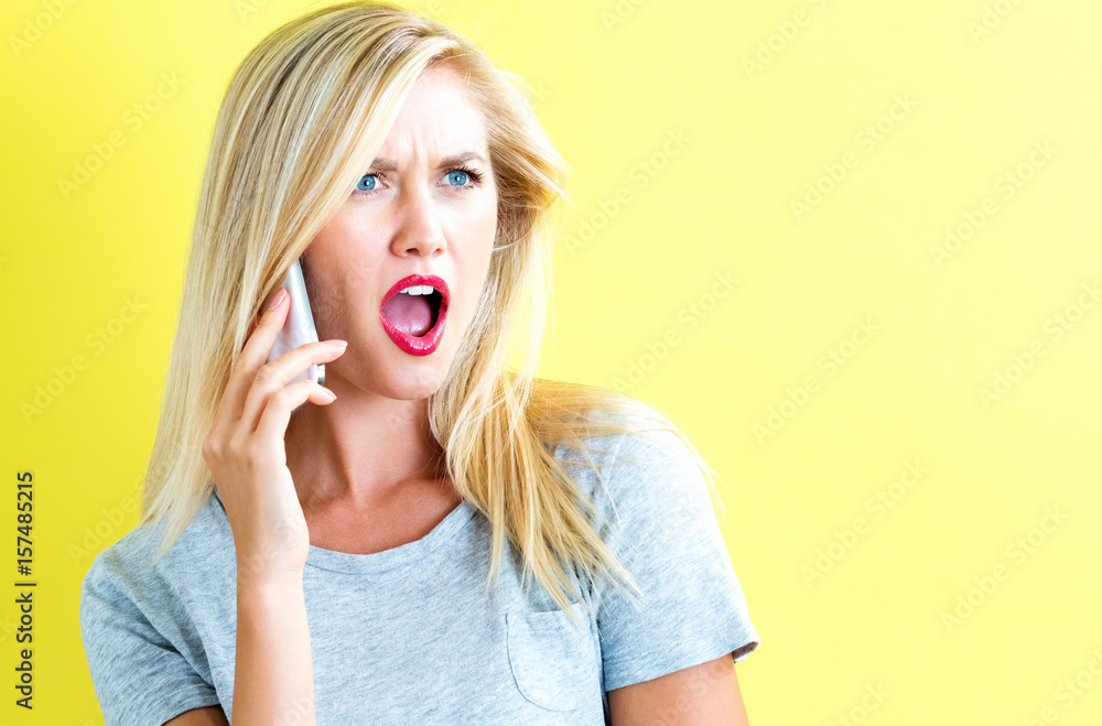 Young woman talking on the phone