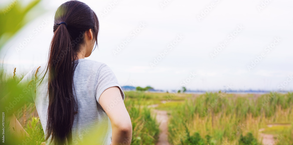 Woman looking out at the path ahead