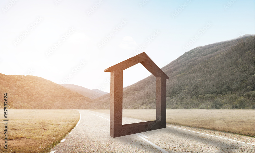 Conceptual background image of concrete home sign on asphalt road