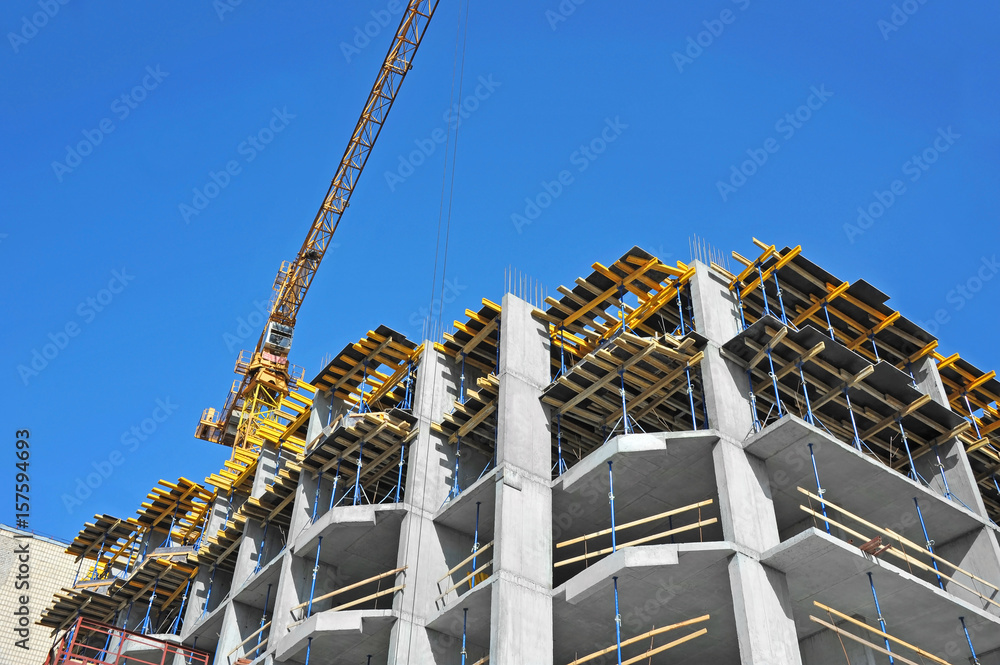 Crane and highrise construction site