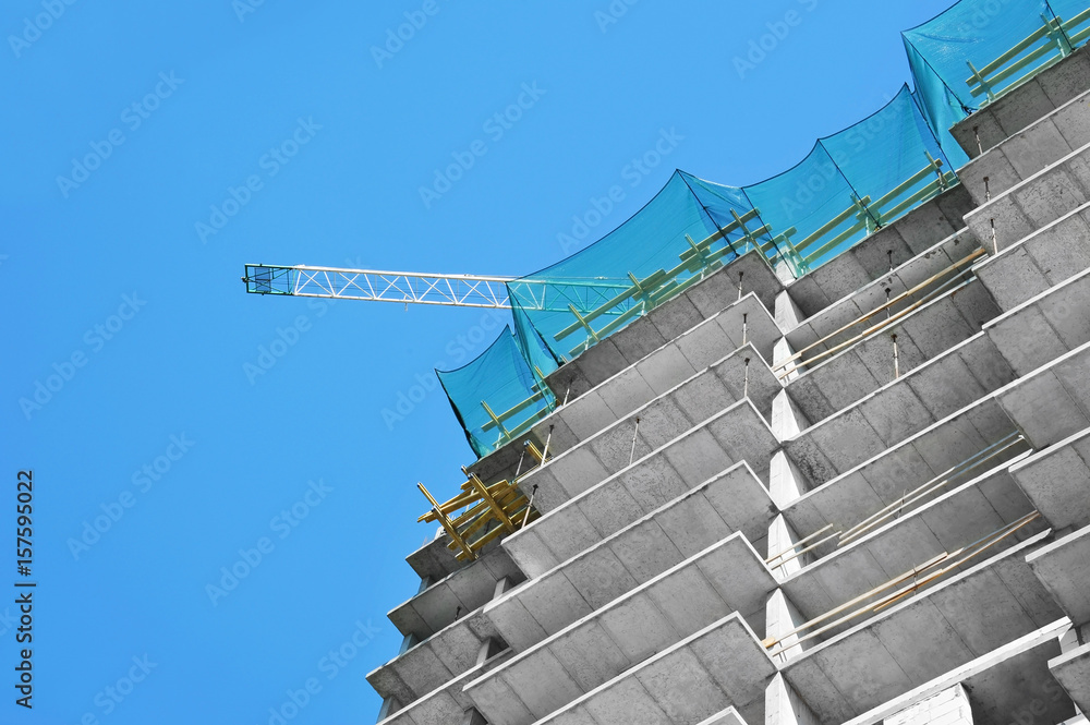 Crane and highrise construction site