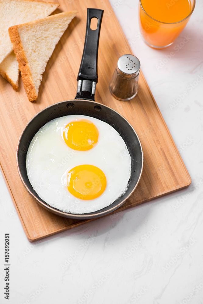 Traditional breakfast with fried eggs on a plate