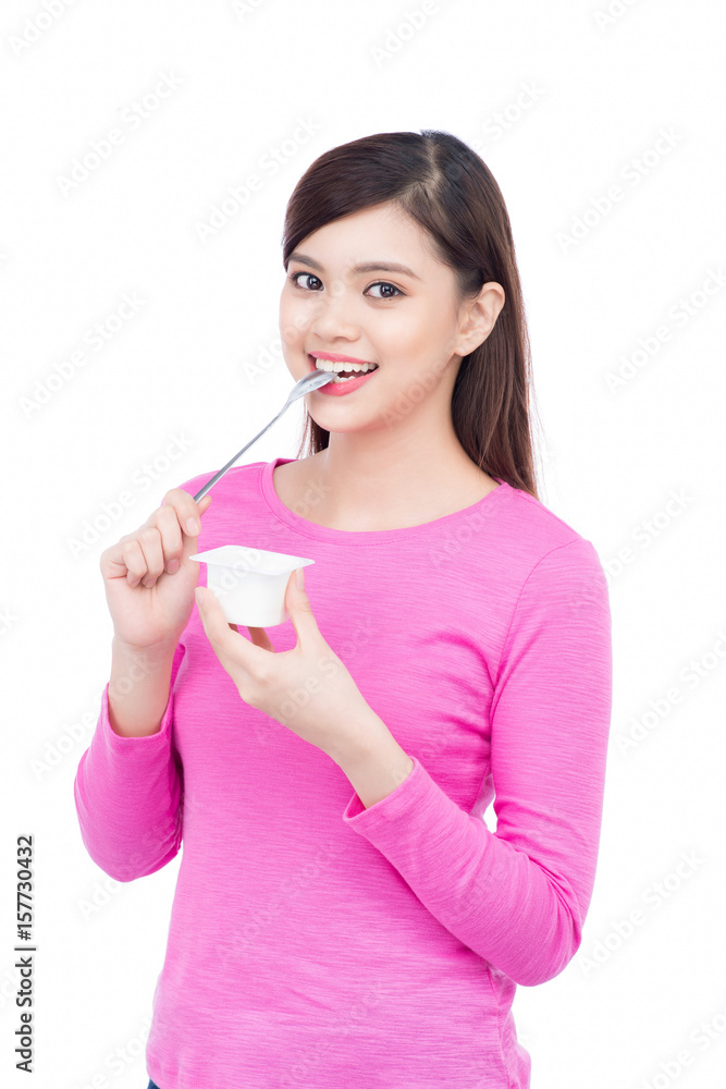 Young asian female enjoying taste of yogurt isolated on white