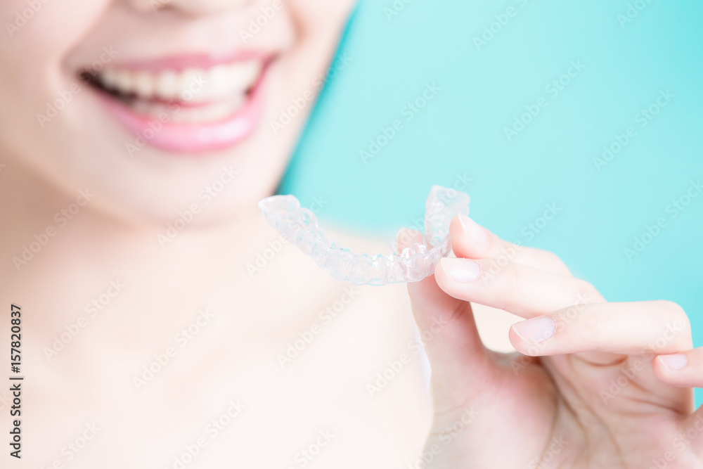 woman take invisible braces