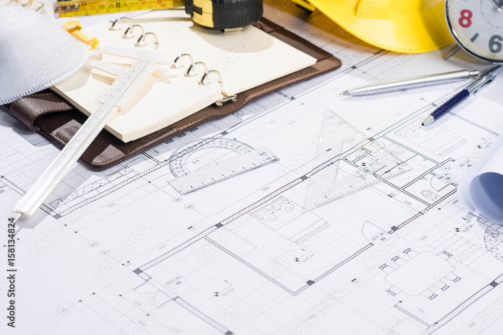 Architects workplace - architectural project with blueprints.