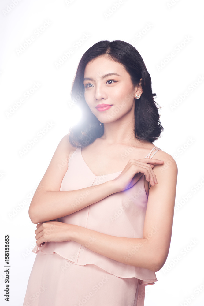 Beautiful happy cute asian woman in casual pink dress with red lips on white background