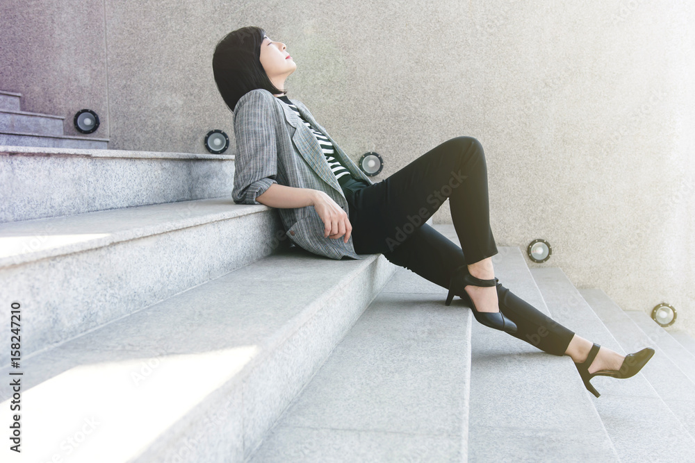 Business Working Woman sit on stair in relaxation posture, closed eyes and thinking for solution or 