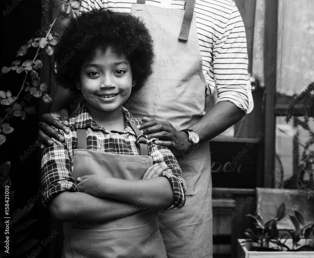 Kid Gesturing Stand in Front of Plants Shop