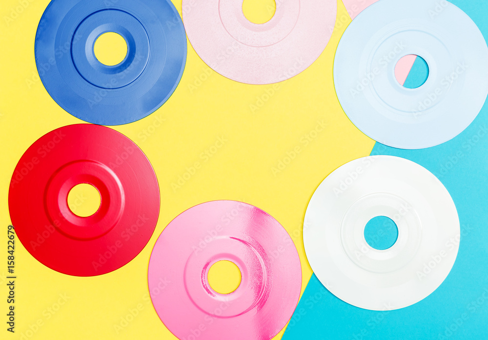 Painted vinyl records on a bright background