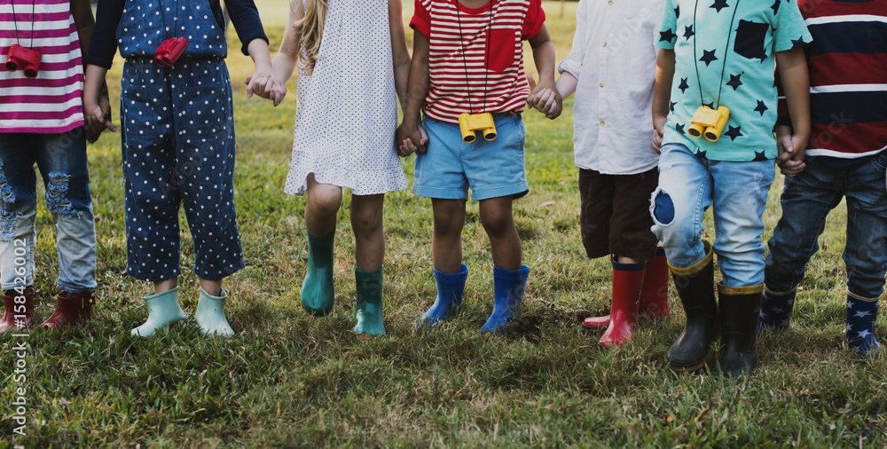 Group of kindergarten kids learning gardening outdoors field trips