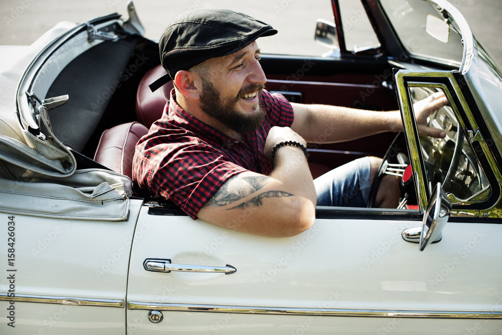 Man Driving a Car with Windows Down