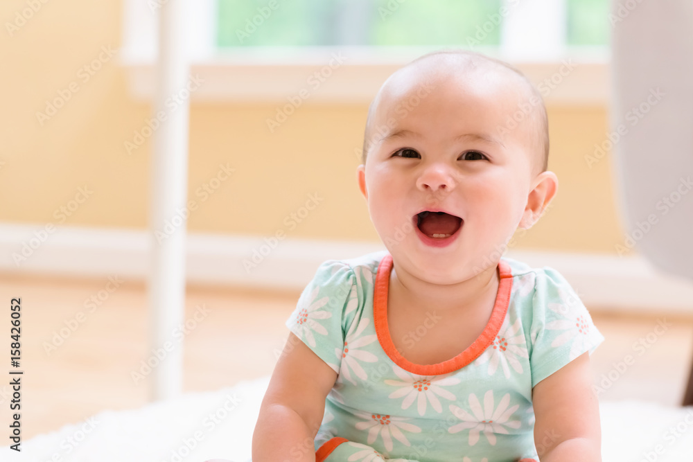 Toddler girl playing in her house