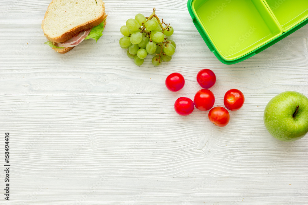 healthy food in lunchbox for dinner at school white table background top view mockup