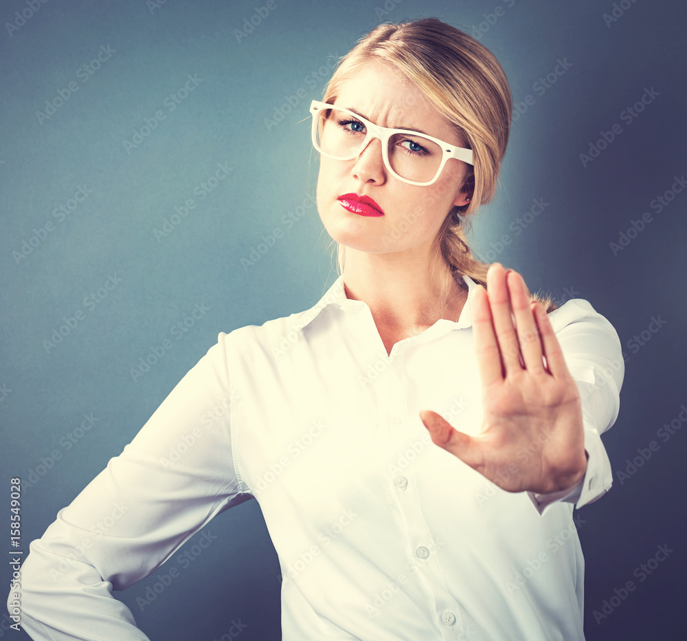 Young woman making a rejection pose