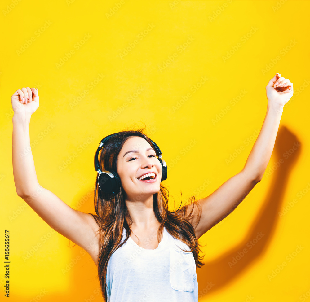 Happy young woman with headphones