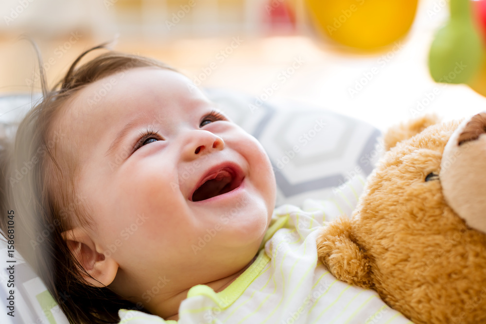 Baby boy playing with his toy