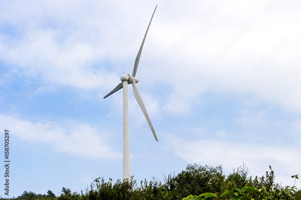 Wind turbine against mountain