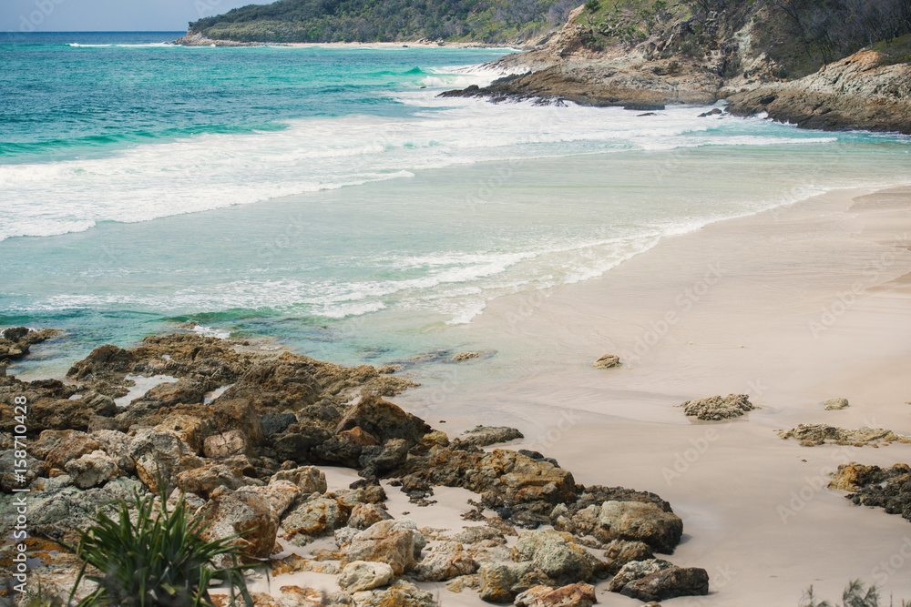 View of the pristine beachfront at North Point, Moreton Island during the day.