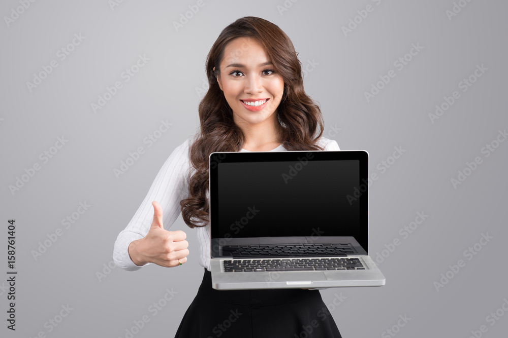 Confident asian business woman showing laptop screen.