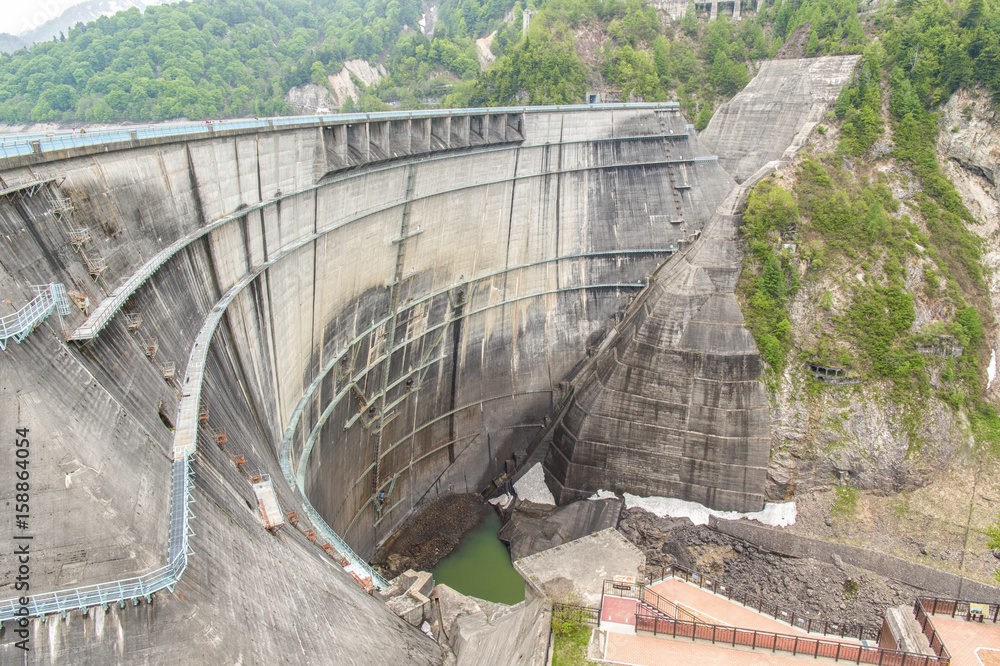 The view of Kurobe Dam. The Kurobe Dam or Kuroyon Dam is a variable-radius arch dam on the Kurobe Ri