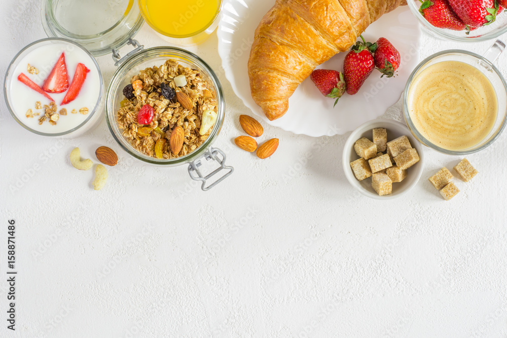 set of healthy ingredients for breakfast on white background. Top view with copy space