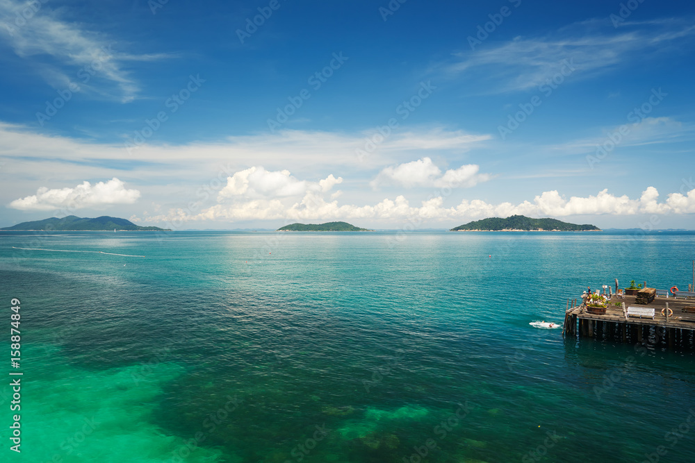 Traveler have fun on the jetty of the port in the sunny day , Rawa island , Malaysia .