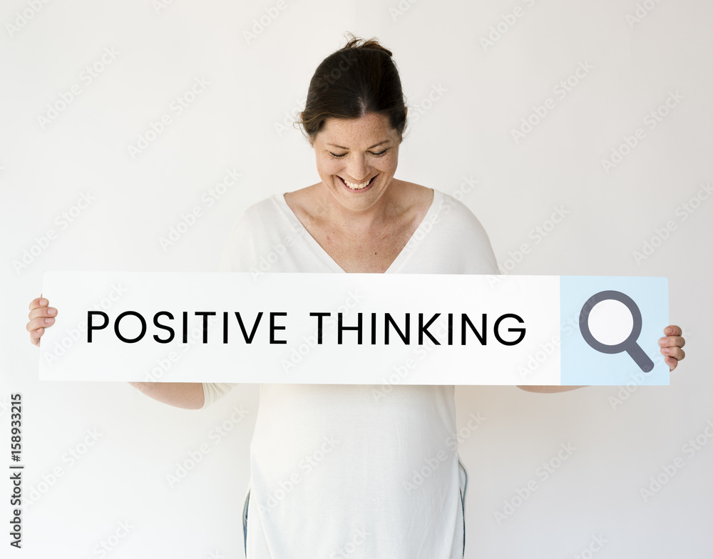 People holding and showing the positive thinking word