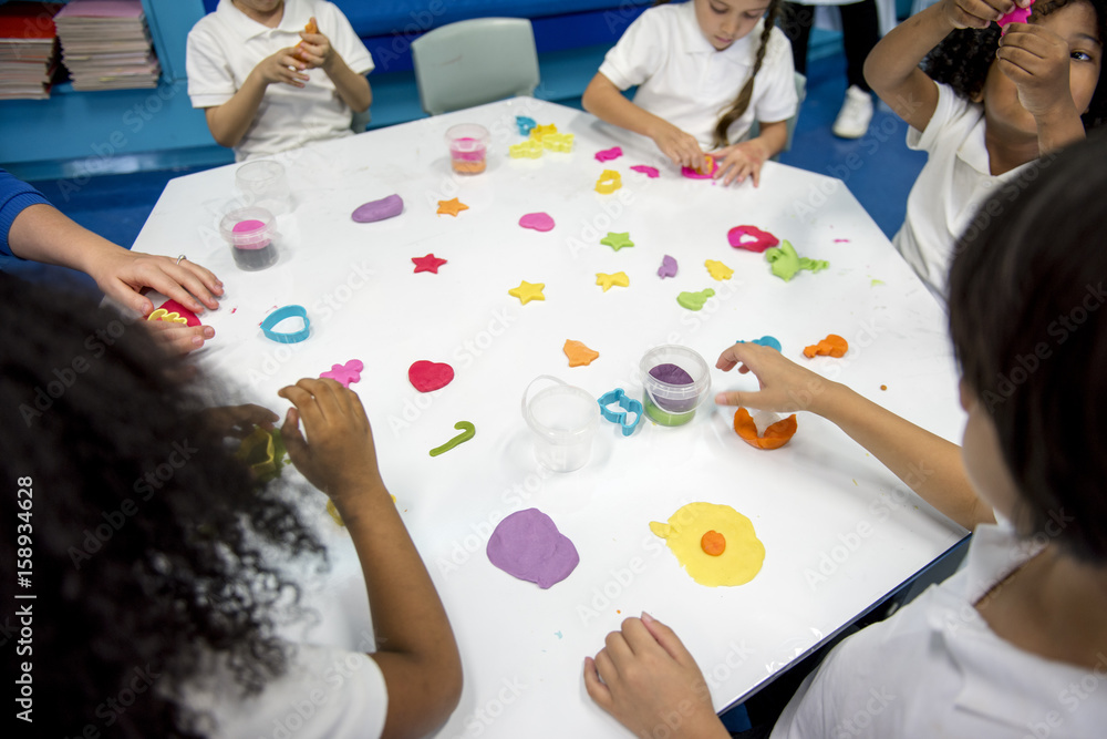 Kindergarten students learning shape with colorful clay