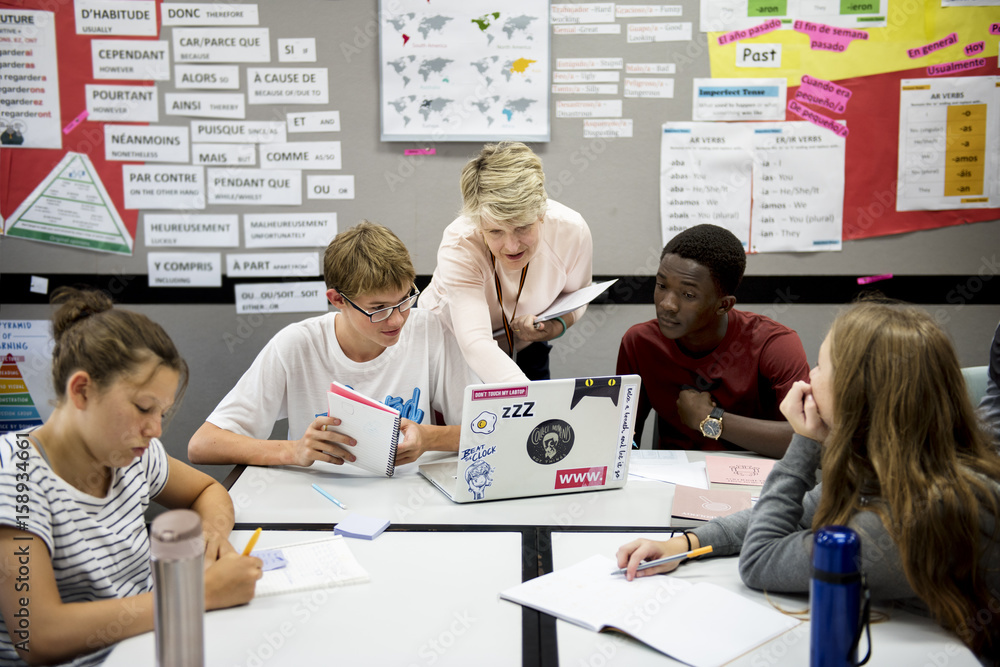 Group of students learning in classroom