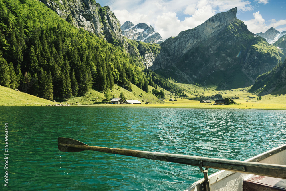 wooden rudder in front beautiful Seealpsee lake and Alpstein mountain in Appenzell, Switzerland