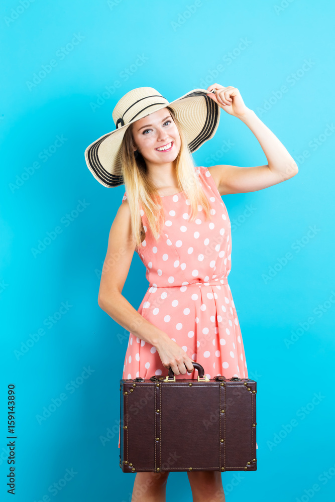 Happy young traveling woman