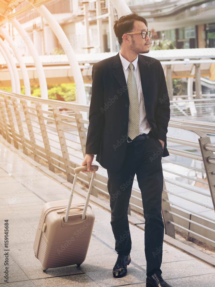 Businessman with travel bag is on business trip