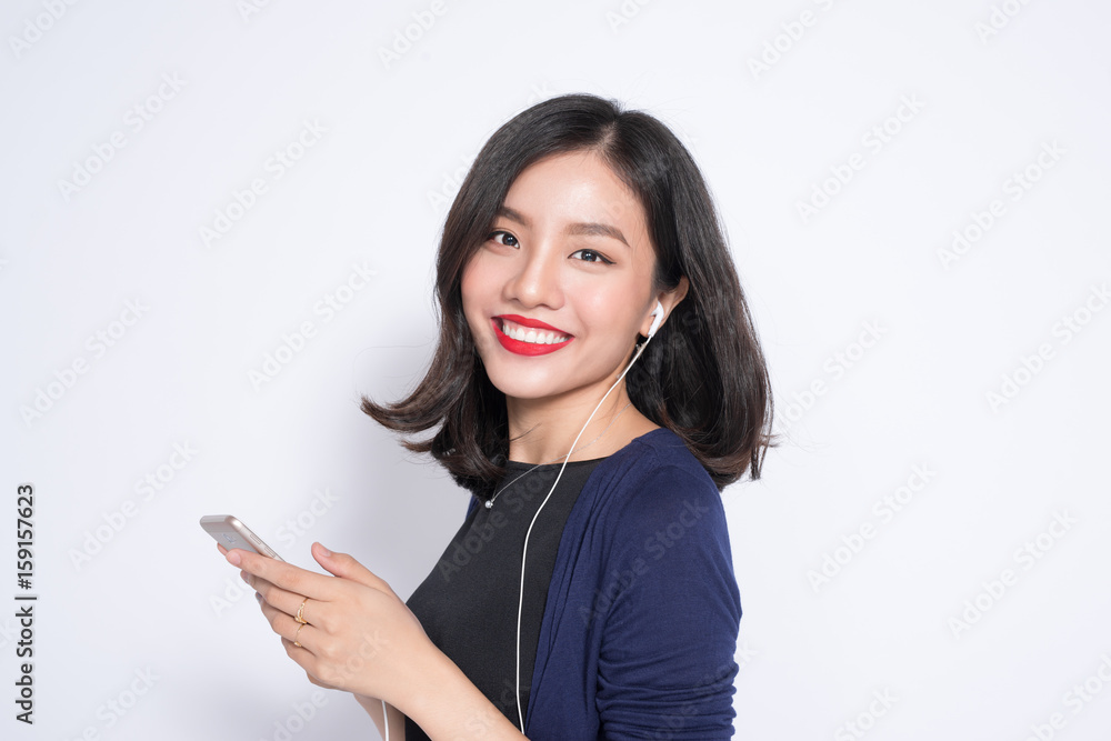 Young asian woman using smartphone isolated on white.