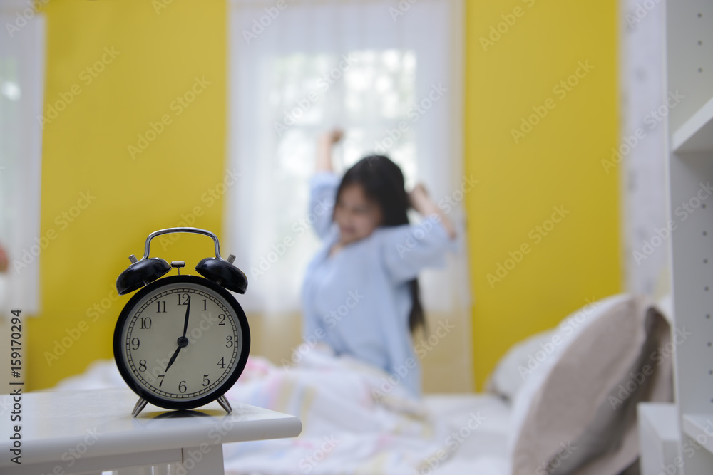 Woman stretching in bed after wake up