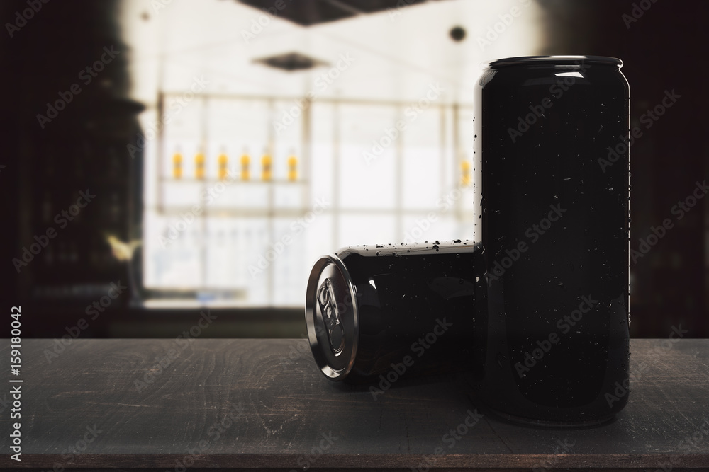 Black soda cans on blurry background