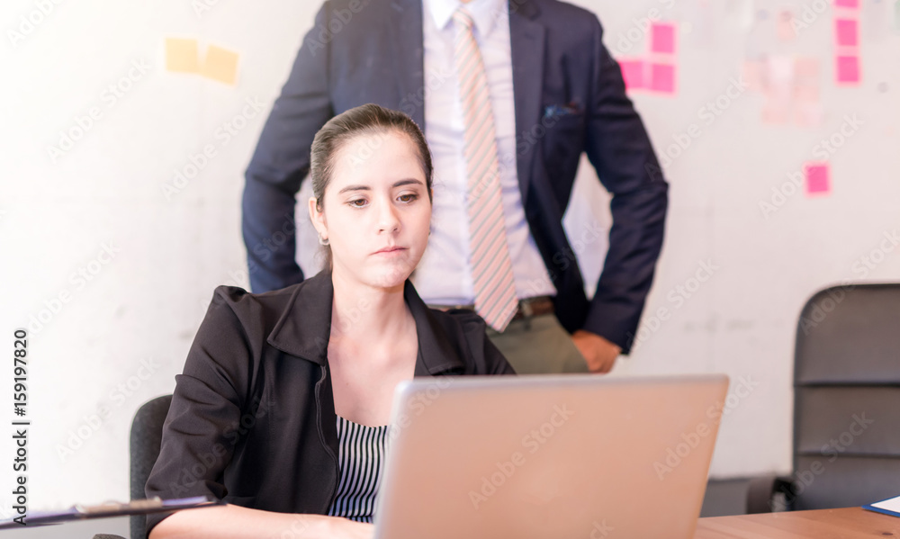 young attractive tired, overworked and exhausted female office worker