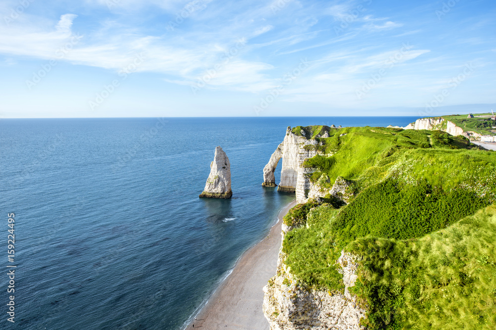 Landscape view on the famous rocky coastline near Etretat town in France during the sunny day