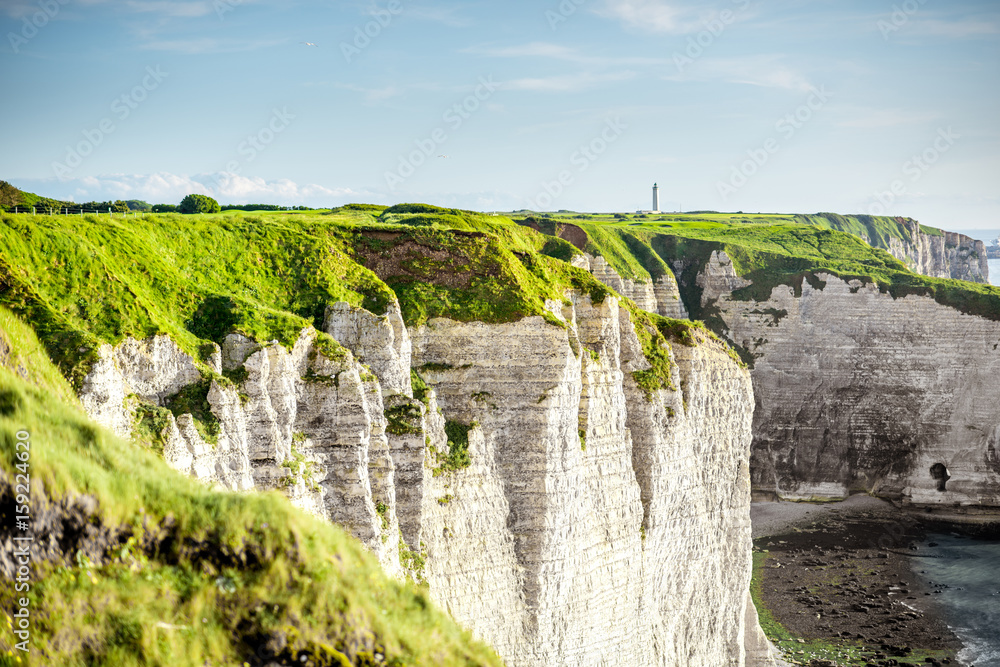 Landscape view on the famous rocky coastline near Etretat town in France during the sunny day